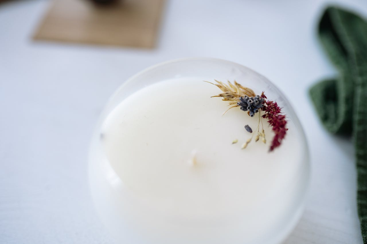 Candle in the foreground, with bokeh circles in the background.